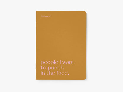 Notitieboek A5 van typealive, okergeel met witte tekst 'people i want to punch in the face.', vooraanzicht