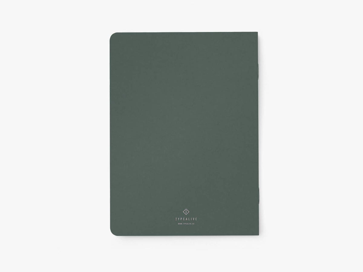 Achterkant van het donkergroene notitieboek 'My list of bodies I buried in the woods' van typealive