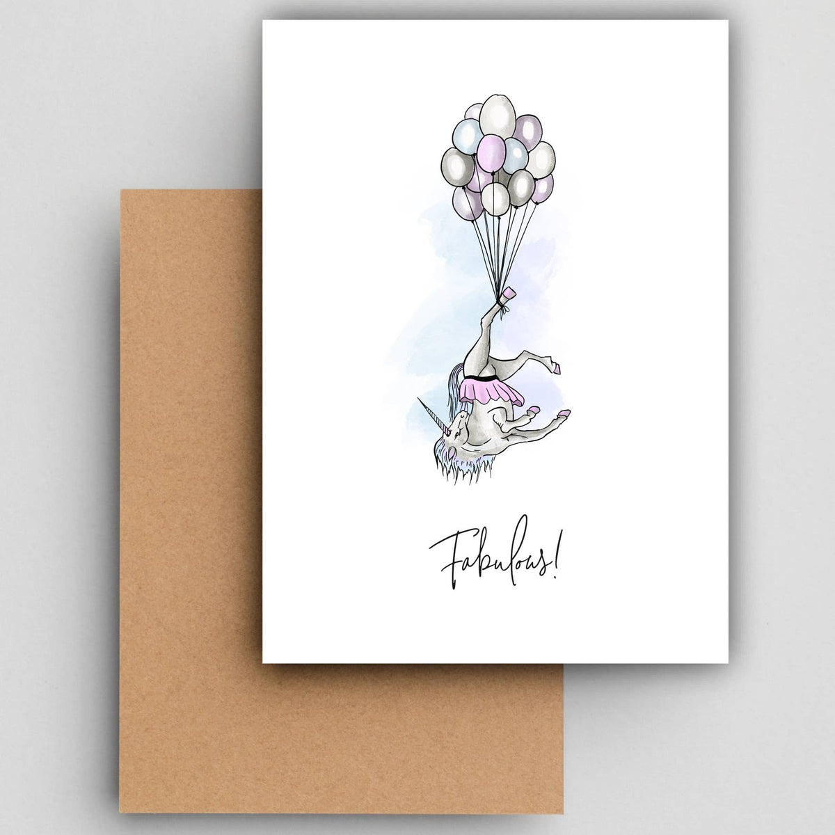 Wenskaart Fabulous unicorn van Studio Raquelle: een eenhoorn die ondersteboven aan een tros ballonnen hangt, met de tekst Fabulous!