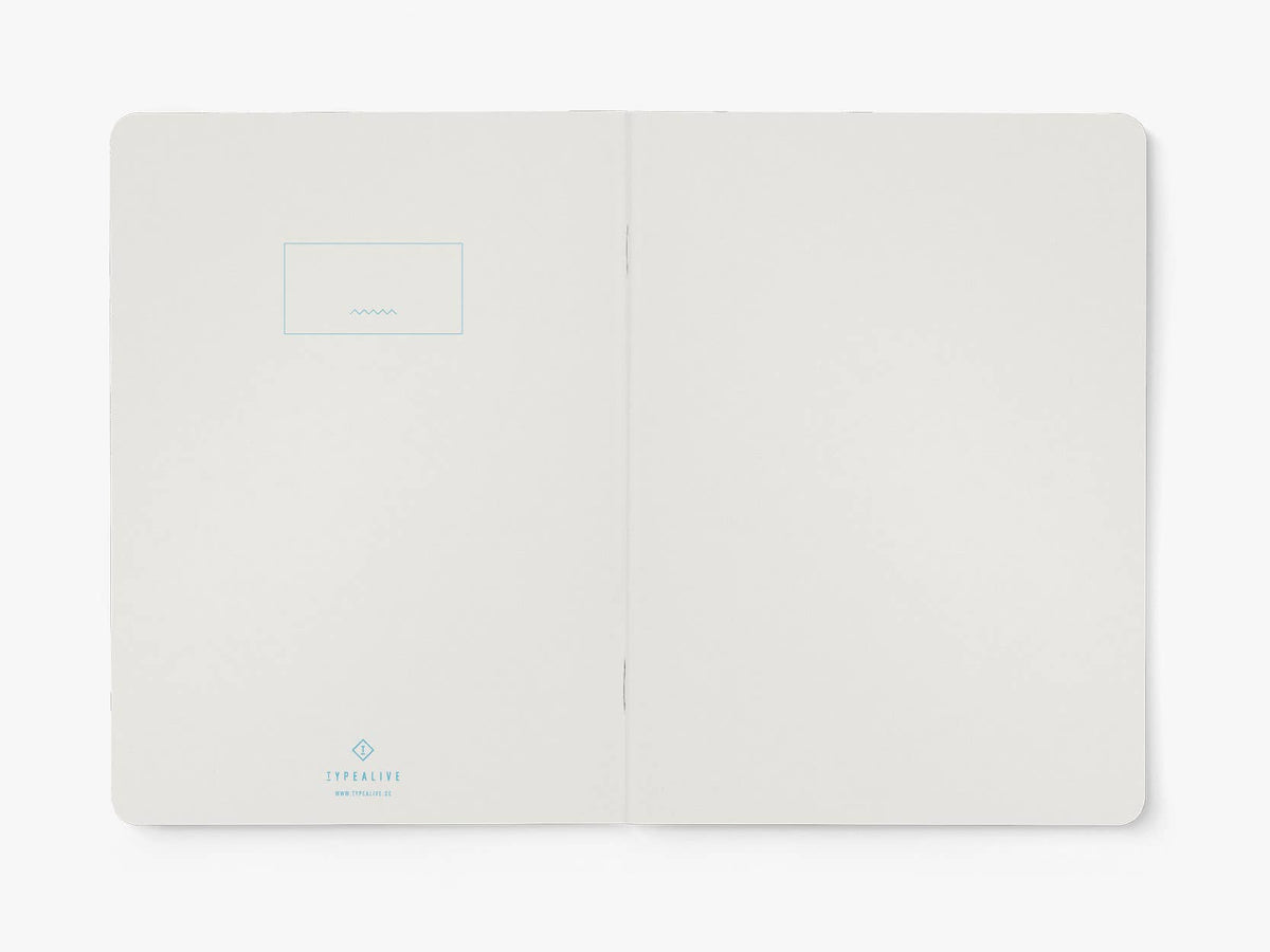 Opengeslagen notitieboek van typealive met blanco pagina's